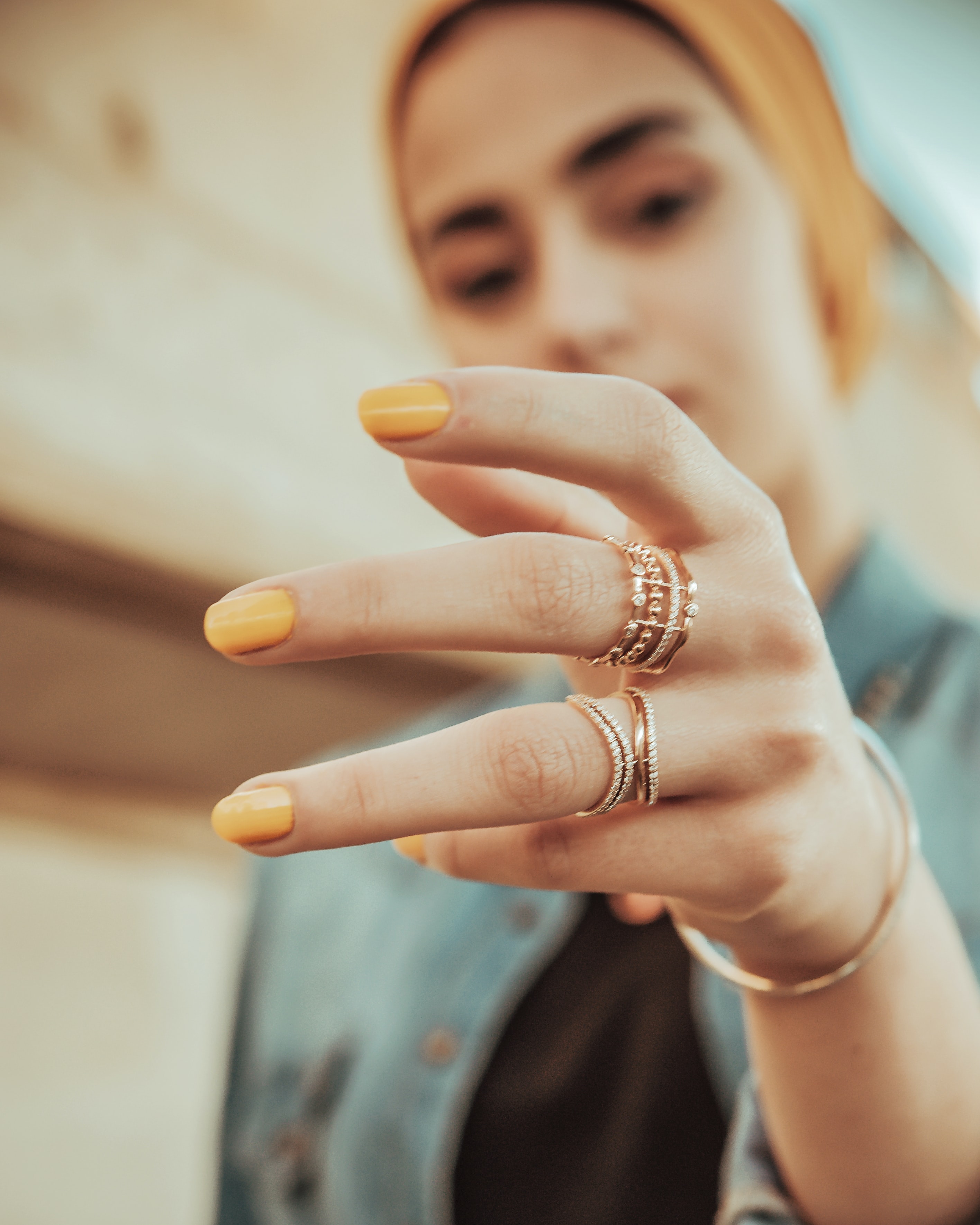 hand with several gold rings